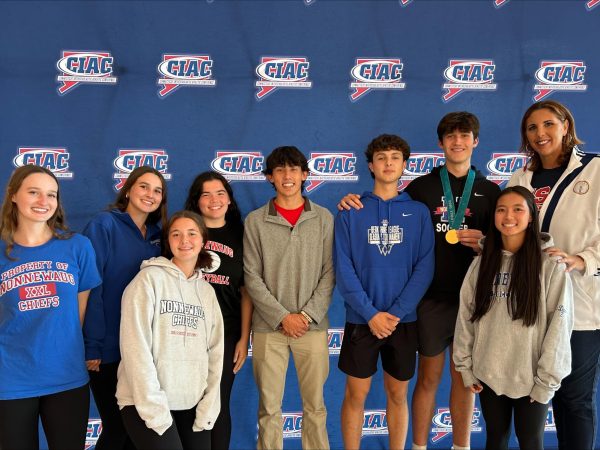 Nonnewaug Athletes' Council members, from left, Kelly Farrell, Katie Farrell, Savannah Czerepacha, Emma Jackson, Liam Sandor, Thomas Lengyel, Matt Shupenis, and Ellie McDonald, pose with Olympian Kara Wolters at the annual CIAC Sportsmanship Conference. They attended this conference to help promote sportsmanship in the Nonnewaug community. (Courtesy of Kyle Brennan)