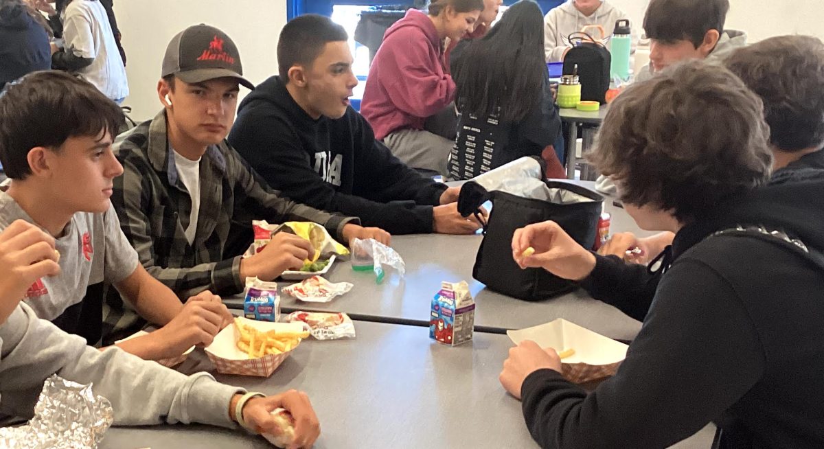 From left Josh Zapatka, Max Lapke, Joey Boyne and Jackson Demer eating lunch and socializing during their break.