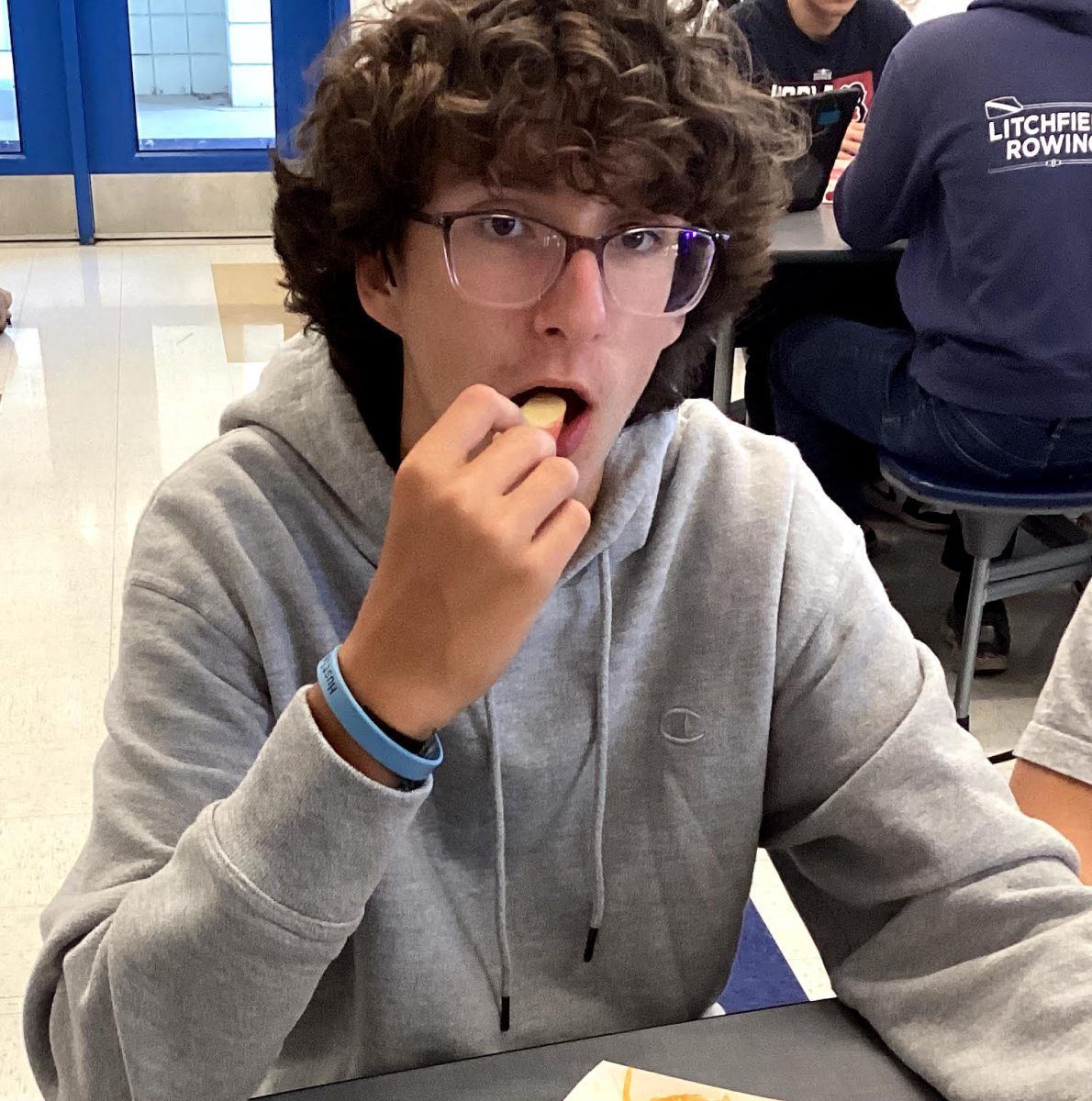 Johnny Carrara eats an apple at lunch. Carrara is among students who complain about portion sizes.
