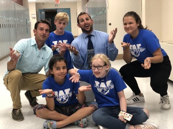 Joshua Kornblut, third from left in back row, poses with previous co-worker Adam Brutting, left, and old students at Woodbury Middle School on Sept. 19 2019. Kornblut now teaches science at Nonnewaug. (Courtesy of Joshua Kornblut)