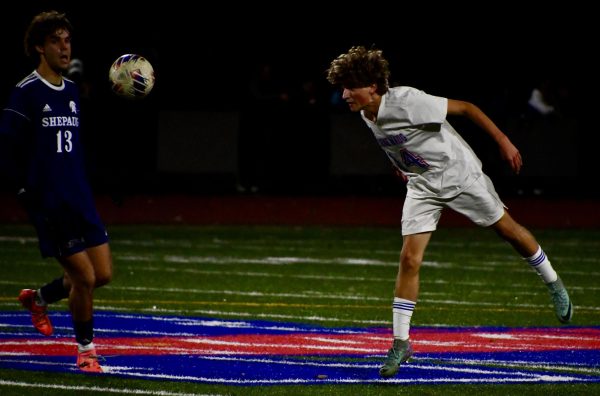 Dylan Diezel completes a header on Nov. 1 against Shepaug during the BL finals.