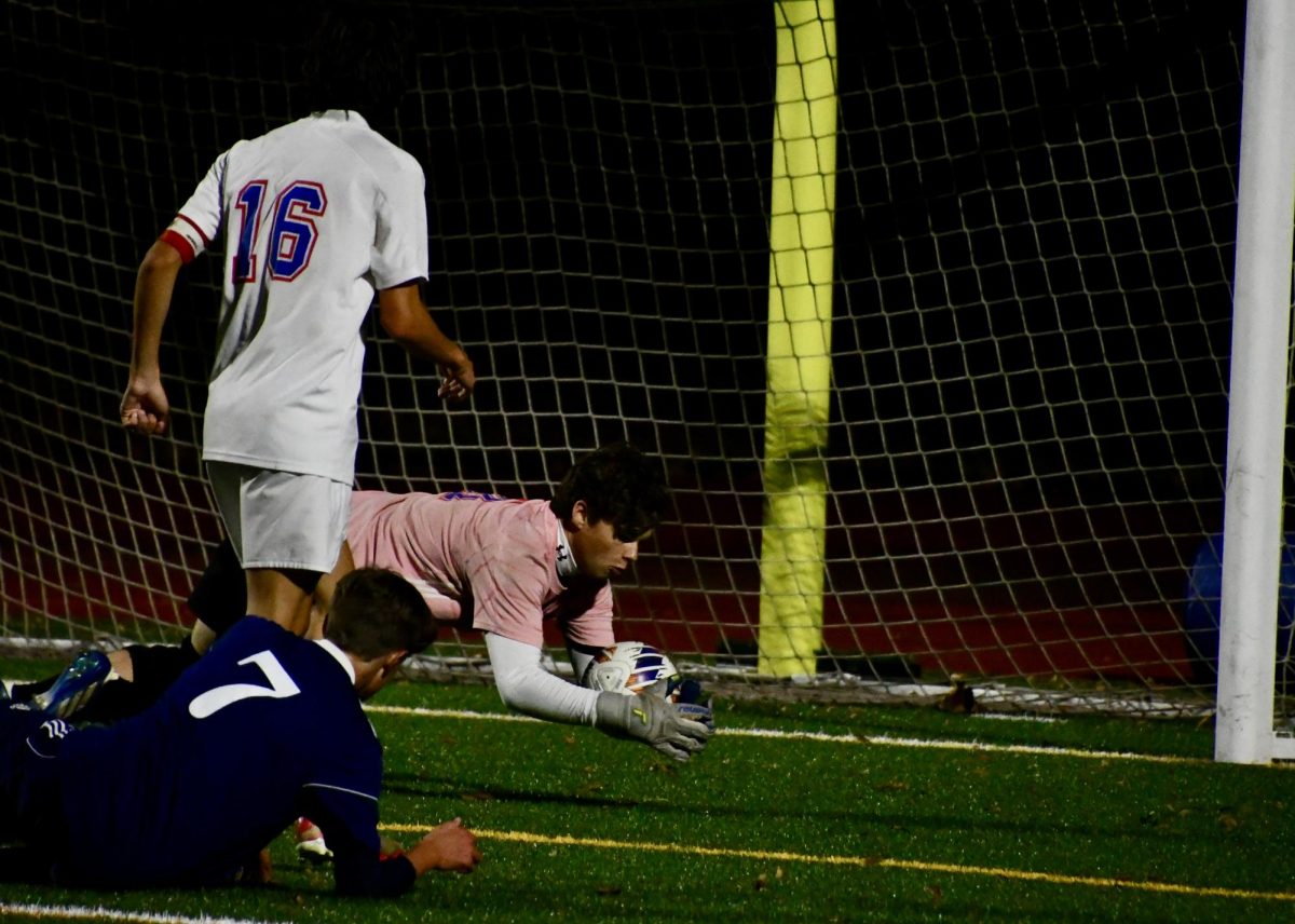 Nonnewaug goalie Noah Sapack saves the ball on Nov. 1 against Shepaug during the BL finals.