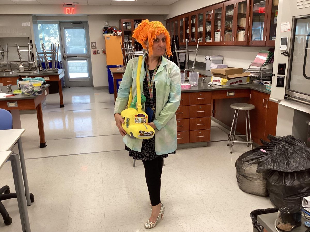 Nonnewaug teacher Melissa Hodges poses dressed up as Mrs. Frizzle from TV show The Magic School Bus at Nonnewaug on Halloween.