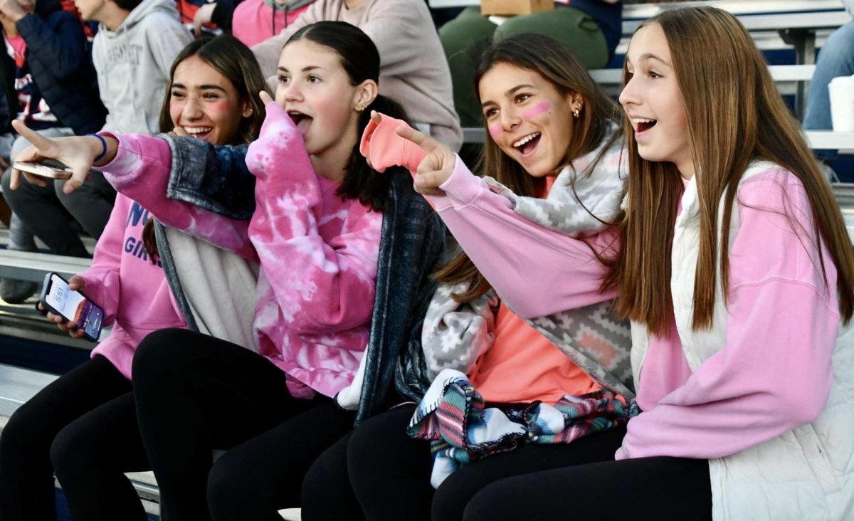 From left, Gianna Perugini, Tatum Kociszewki, Catherine Viveros, and Anna Walkup emphasize a play at the Northwest United football game on Oct. 26.