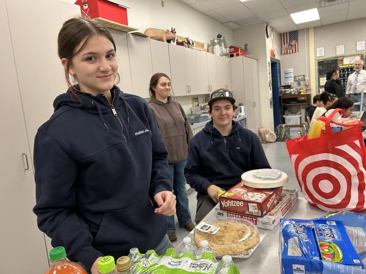 Freshman, Mallory Johnson, is happily participating in Friendsgiving alongside her brother Levi Johnson. Everyone gathered to not only celebrate, but also contribute to the event and support our program.