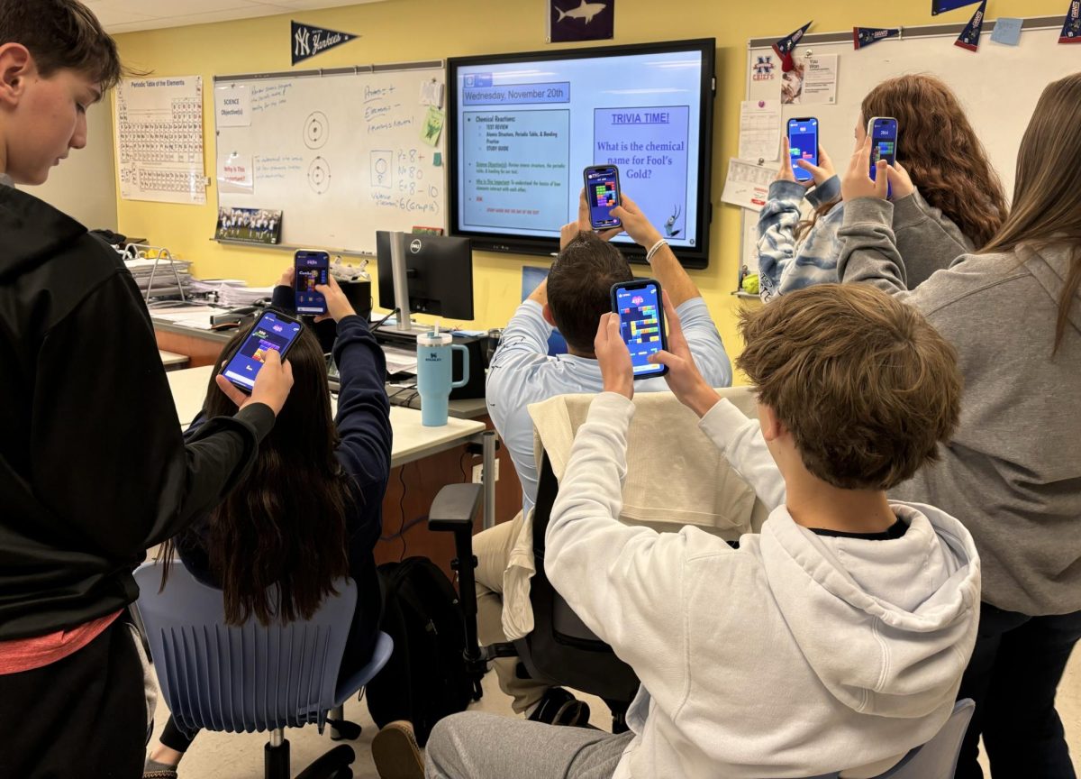 Students in Joshua Kornblut’s science class play Block Blast. Block Blast is becoming more popular for students in class. 