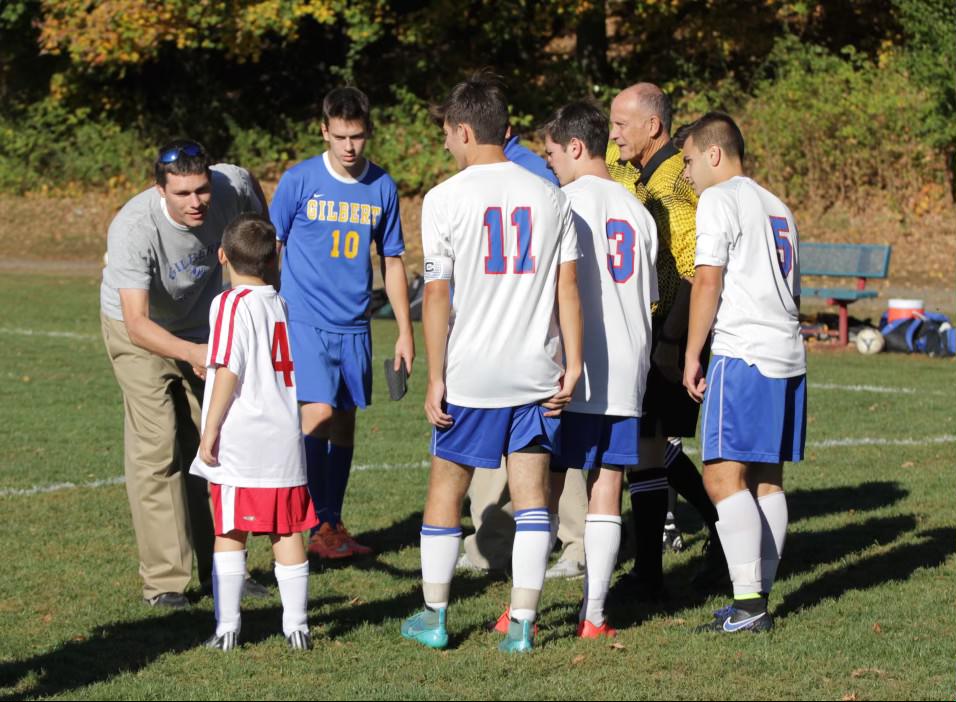 Noah Sapack served as “honorary captain,” shaking hands with the 2016 Gilbert soccer coach. 