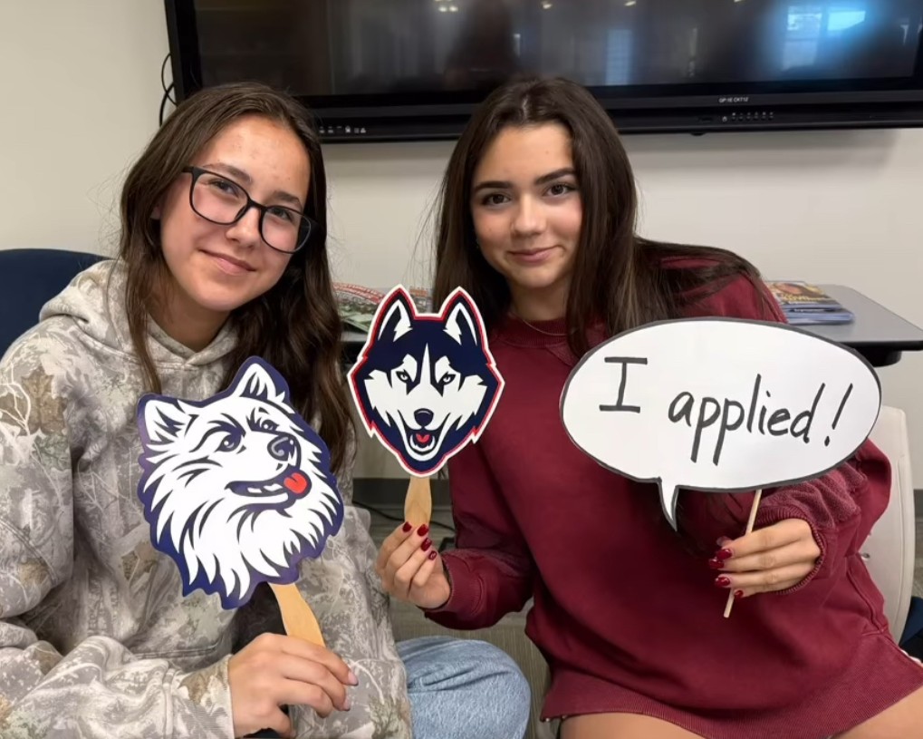 Seniors Karisa Cizauskas, left, and Eva Ripperger pose after completing their applications for UConn. (Courtesy of the Nonnewaug CCRC/Instagram)