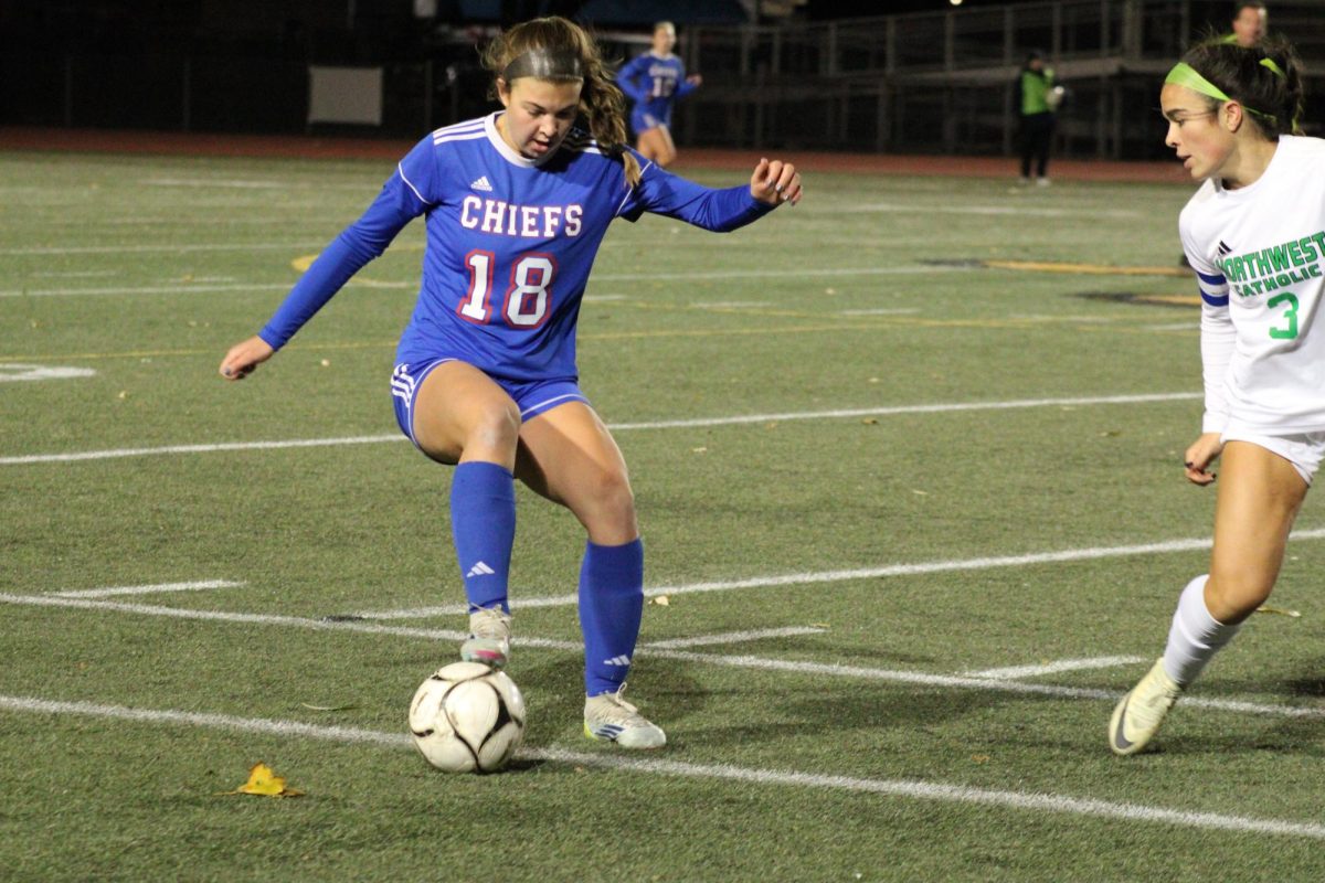 Junior Ella Quinn handles the ball during the girls semi final soccer game on Nov. 12