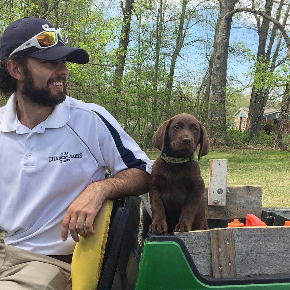 Sean McGee started his career as an athletic trainer at St. Thomas More School in Oakdale. He often brought his dog, Kona, to school. (Courtesy of Sean McGee)