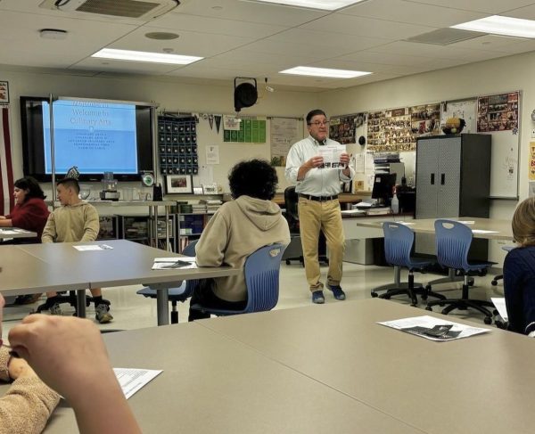 Students from Woodbury Middle School listen to culinary arts teacher John Dominello explain the appeal of his classes during the elective fair held Oct. 30. (Courtesy of Nonnewaug High School/Instagram)