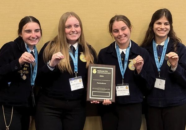 From left, Hannah Kostka, Lillian McDonald, Hannah Searles, and Amy Byler pose after winning gold for their 10th place score in the National FFA Floriculture CDE competition. They spent the week in Indianapolis participating in the 97th National FFA Convention and Expo. (Courtesy of the Woodbury FFA/Instagram)