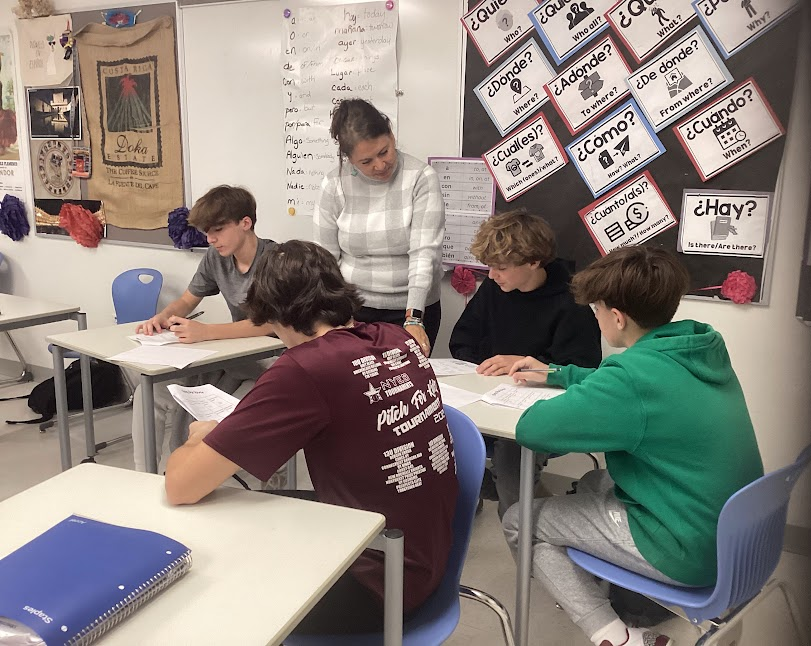 Karen Sandor, a Spanish teacher at Nonnewaug High School, instructs freshmen (from left to right) Zachary Santepietro, Owen Hustek, Micheal Platt, and Darren Sullivan on their coursework.