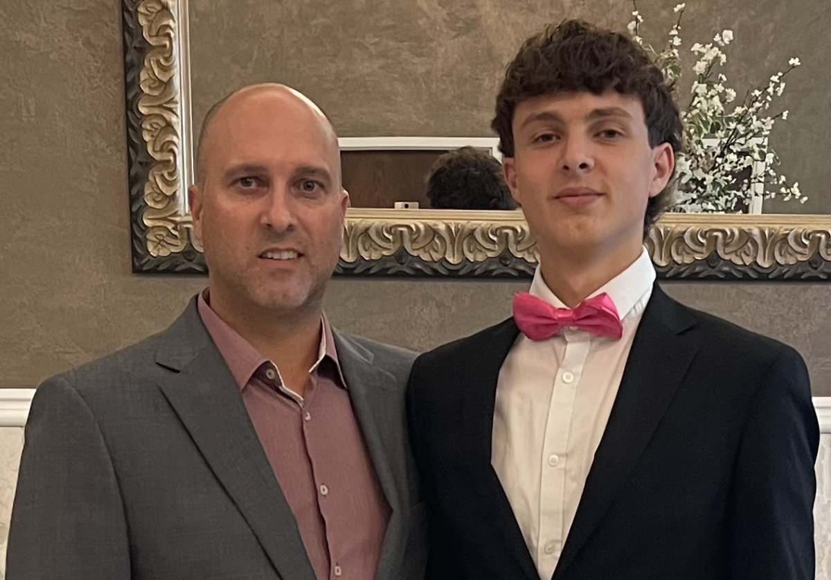 Nonnewaug business teacher Adam Lengyel, left, poses with his son, senior Thomas, at homecoming in September. (Courtesy of Adam Lengyel)