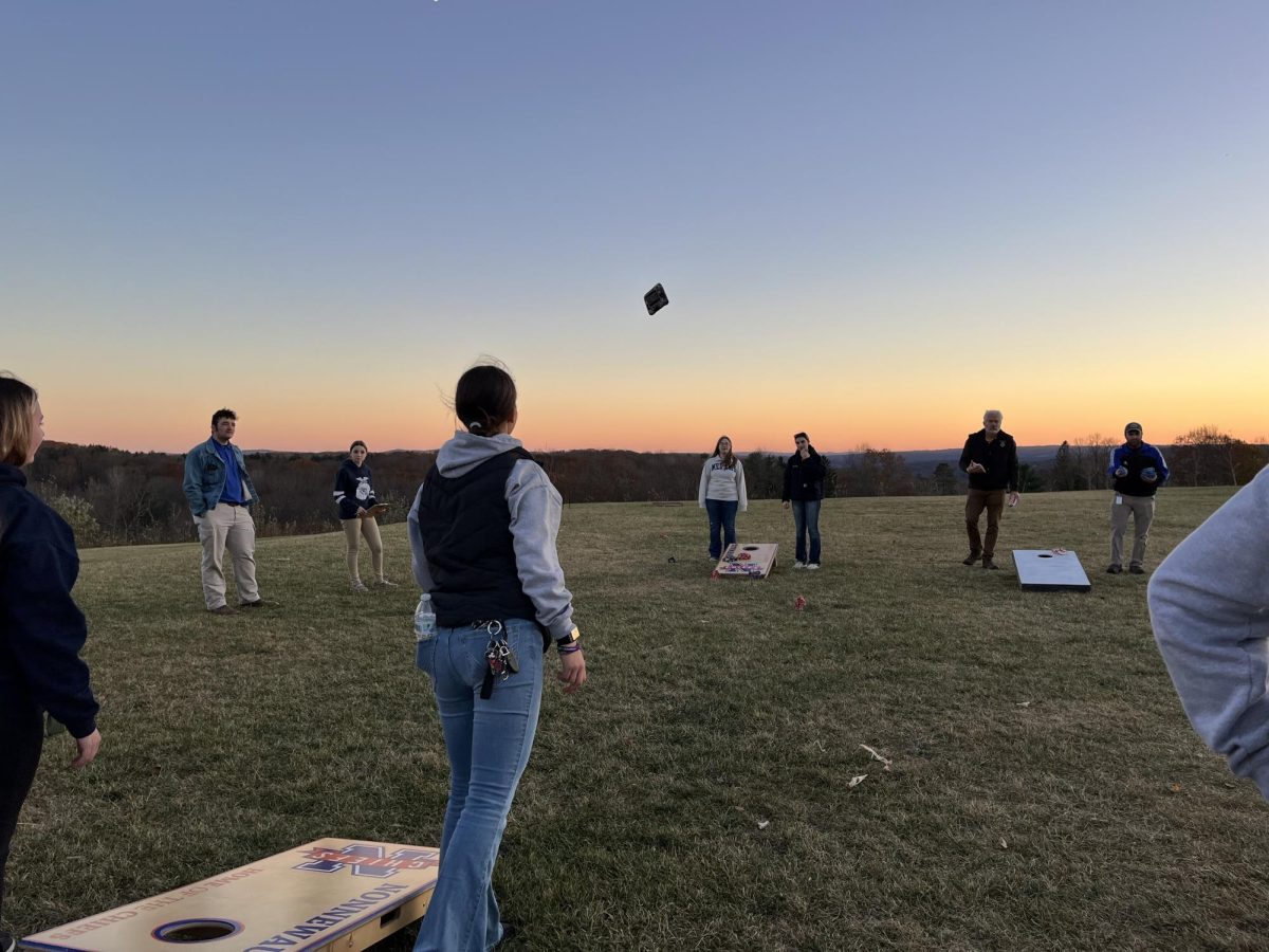 Students from Nonnewaug and Wamogo continue to compete in corn hole on at March Farms during the District 1 social.