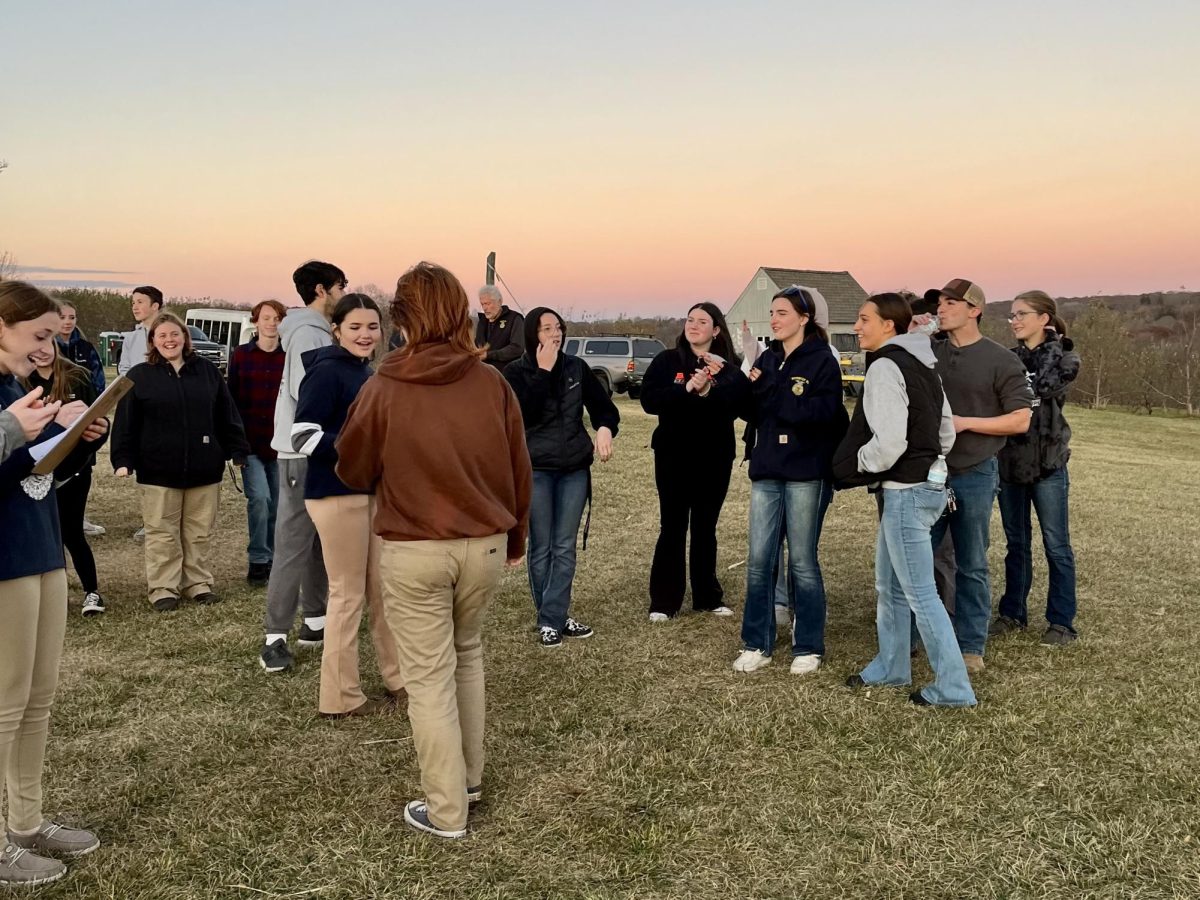 FFA members from Nonnewaug and Wamogo cheer on the winners of the egg-on-a-spoon race during the District 1 social.