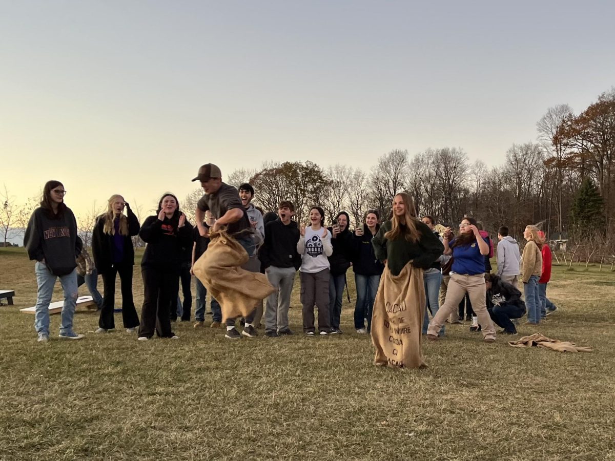 Nonnewaug and Wamogo FFA members compete in a sack race during the District 1 social.