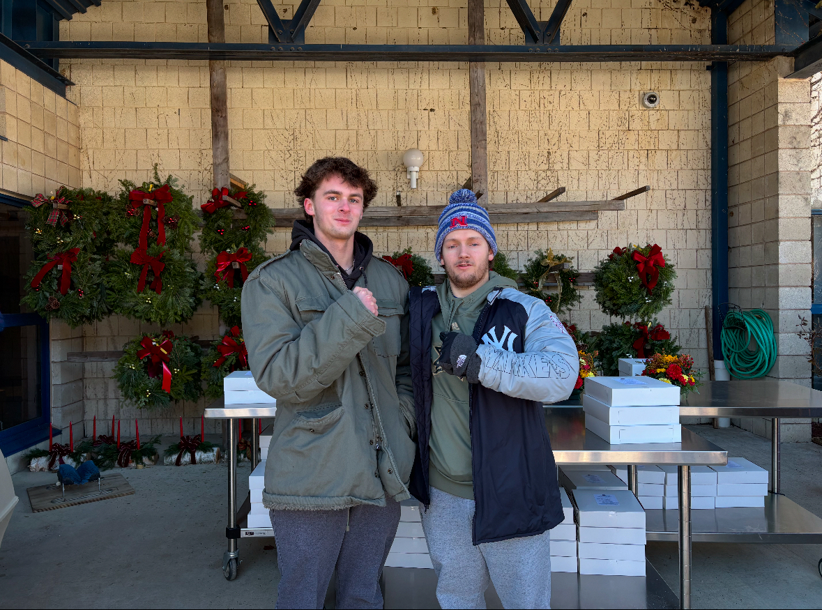 Trevor Santopietro and Mathew Dutton pose for the Senior citizen meal on Dec. 6