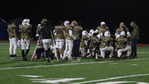 Northwest United huddles after a 42-7 loss to ATI on Nov. 27. It turned out to be the Workhorses' last game of the season as they forfeited their playoff game due to injuries. (Courtesy of Tim Parry)