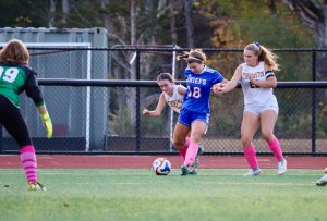 Ella Quinn fights for the ball against Thomaston on Oct. 8. (Courtesy of Josh Makarewicz)