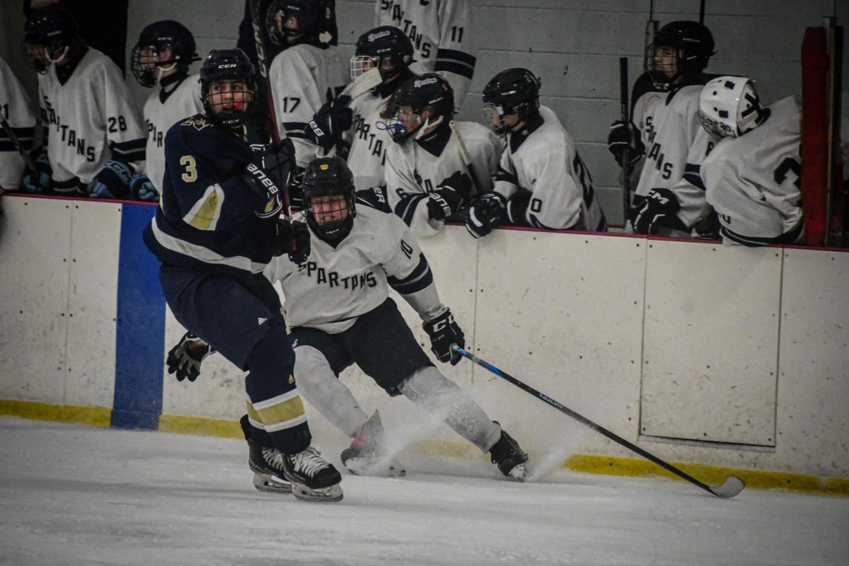 Dan Shelters (10) transitions from offense to defense on Jan. 29 against Newtown/New Fairfield hockey. 