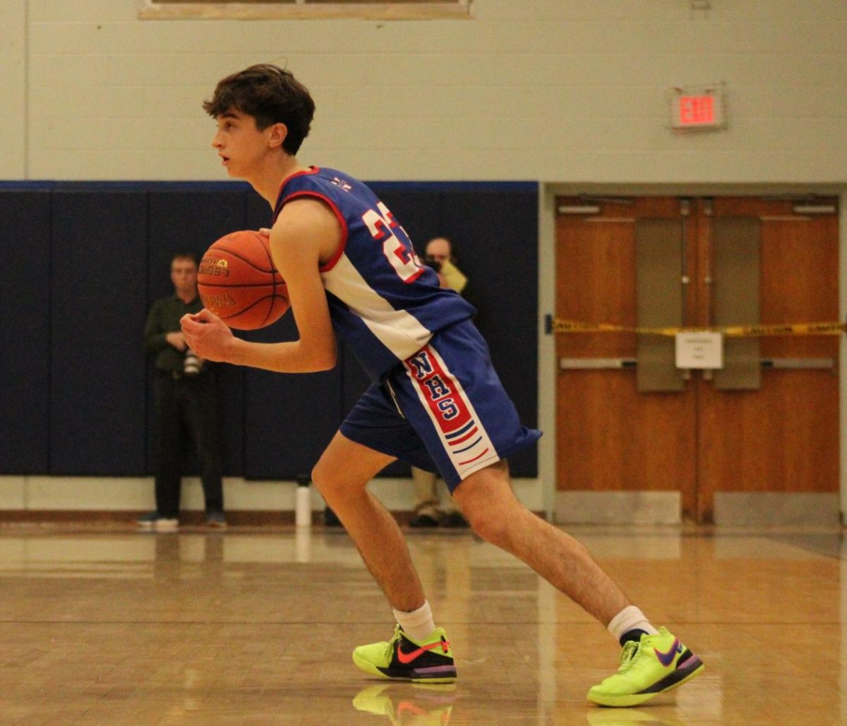 Sophomore Max Nichols dribbles a ball during Nonnewaug boys basketball game against Shepaug on Jan 3.  