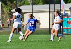 Sophomore Greta Addeo (27) dribbles through opponents during the Nonnewaug girls soccer homecoming game against Shepaug Valley High School on Sept. 19. (Courtesy of Jennifer Salisbury)