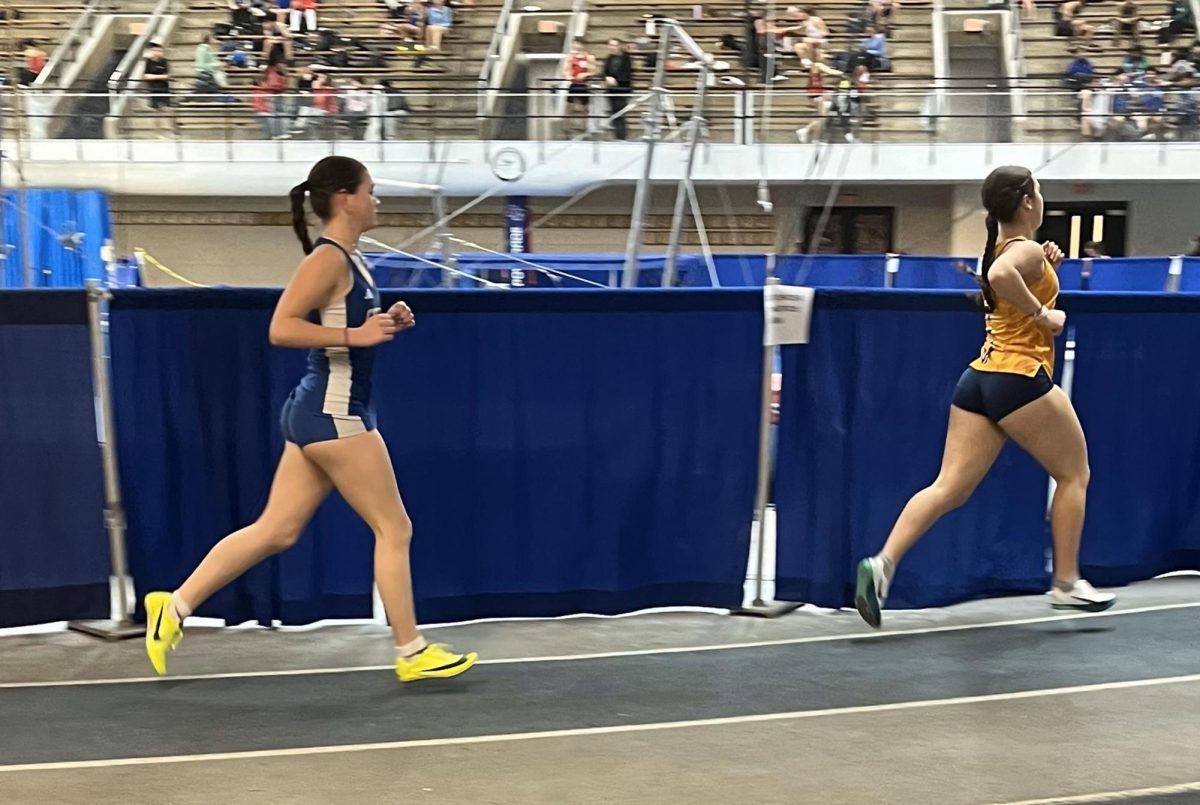 Tatum Kociszewski, left, runs the 1,000 meters at Southern Connecticut State University. (Courtesy of Jocelyn McDougall)