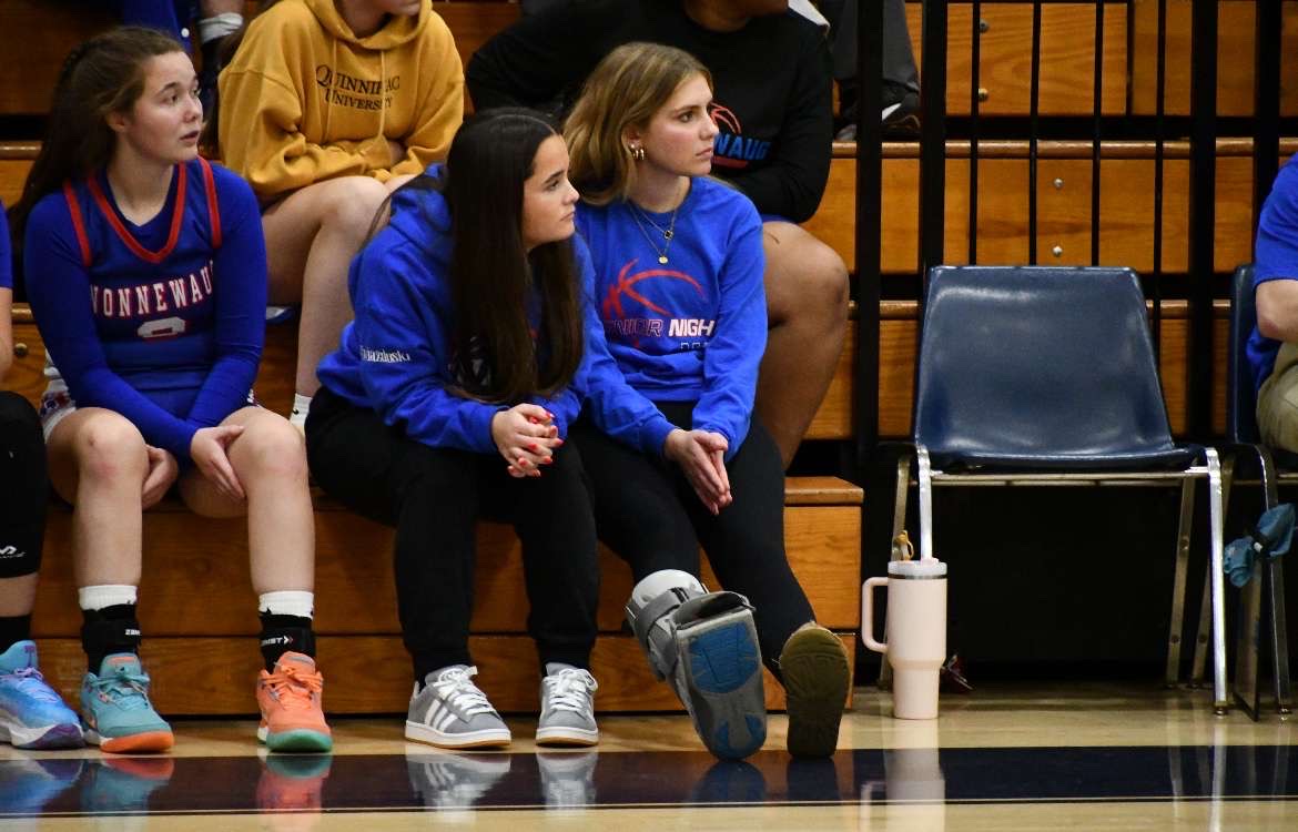 Nonnewaug girls basketball players, from right, Aubrie Salisbury, Olivia Gwiazdoski and Savannah Czerepacha sit on the bench during a Jan. 3 game at Shepaug.