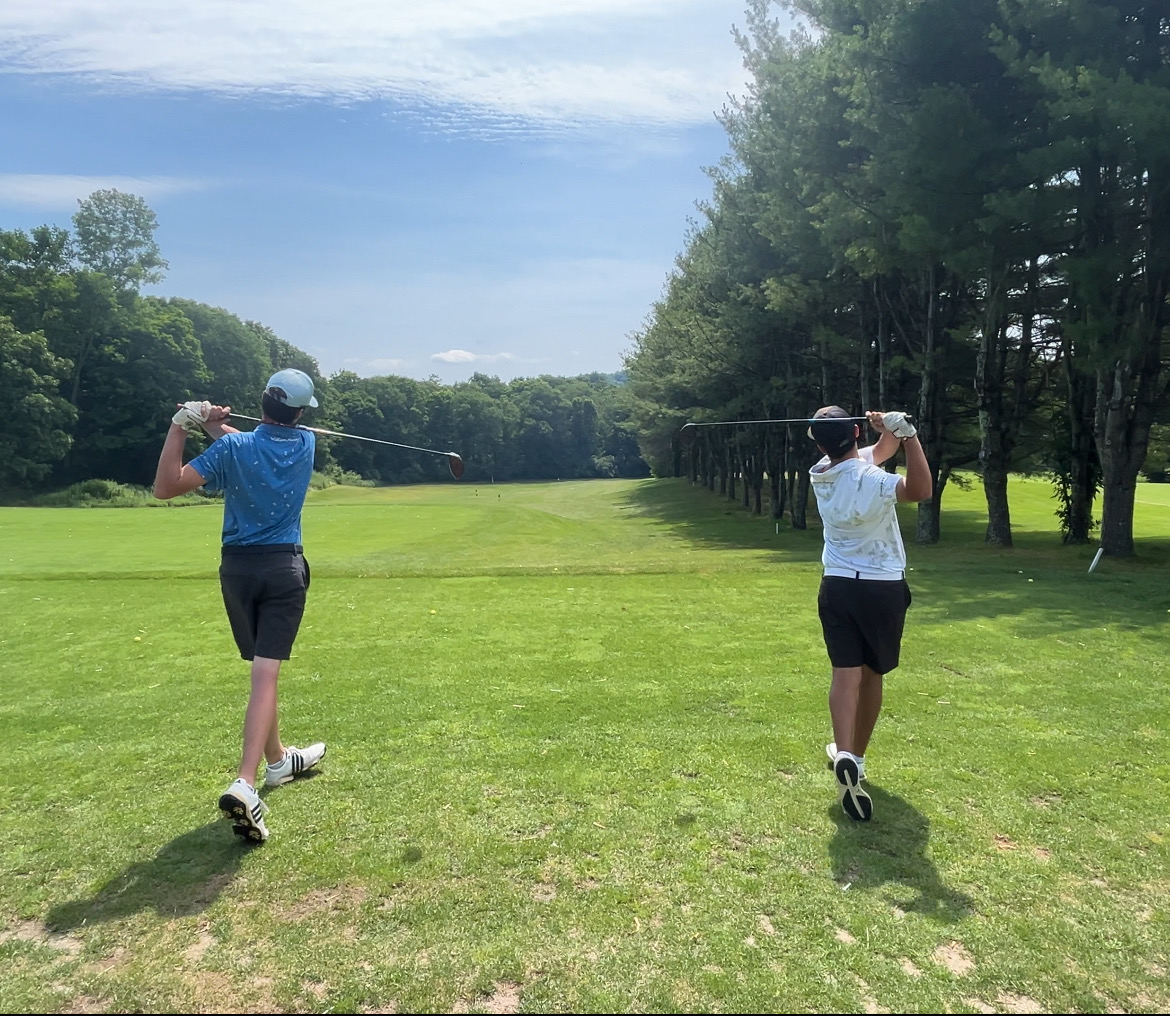 Jack Nettelton and Evan Jones practicing their swings at the silo point country club's driving range in Southbury. Although golf season feels like a distant memory amid the ides of winter, the golf's team duo is prepared for even more success this coming fall. Photo contributed by Jack Nettleton