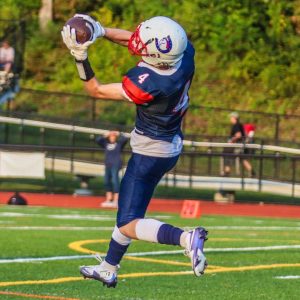 Senior R.J. Barksdale catches the ball during a football game this last season. Football is one of the sports Barksdale plays. (Contributed from Norren Chung)  