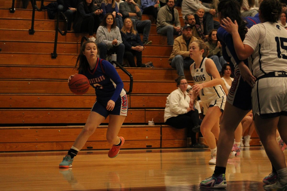 Senior Savannah Czerepacha dribbles the ball during Nonnewaug girls basketball game against Shepaug on Jan 3.  