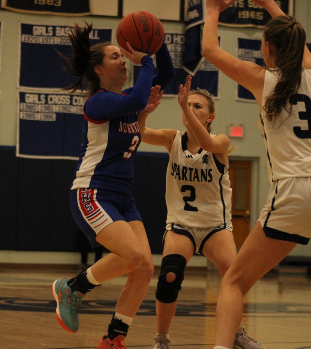 Senior Savannah Czerepacha shoots the ball during Nonnewaug girls basketball game against Shepaug on Jan 3.  