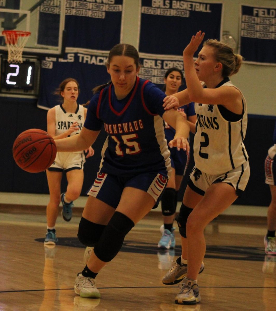 Sophomore Elliana Obolewicz dribbles the ball during Nonnewaug girls basketball game against Shepaug on Jan 3.  