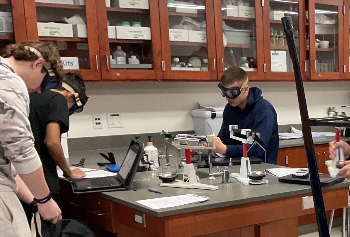 Students in Melissa Hodges' AP Chemistry class set up a lab earlier this month.