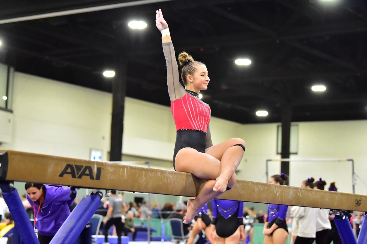 Maryn Heinrich performs on the beam, at a recent gymnastics meet and it’s on the mat or beam that she feels most comfortable. This season Heinrich found success at competitions such as the Rhode Island Invitational where she earned 2nd place.  (Courtesy of Maryn Heinrich) 