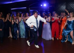 Assistant Principal, Mr. Curtain shows off his dance moves to keep the night young at 2024’s prom night. Rumor has it, Curtain is learning new moves for this year's prom at the Aqua Turf in Plantsville. “As a person with a strict authoritative personality, it’s nice to see him lighten up,” says senior Abby Rinaldi. Photo Credit: Images Studio