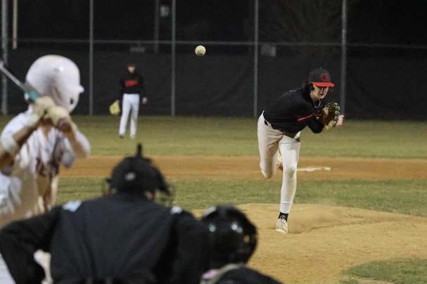 Nonnewaug sophomore Jackson Demers throws a pitch during a summer baseball game. Demers knows that if wants to play in college, he'll need to increase his velocity, which comes with a risk of injury. (Courtesy of Jackson Demers)