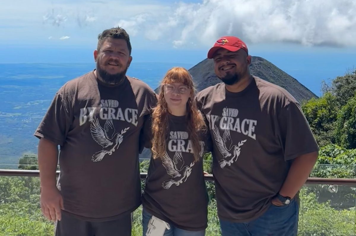 Nonnewaug senior Abby Risi, center, poses with fellow members of her New Life Church on a mission trip to El Salvador last fall. Despite being roughly the size of New Jersey, El Salvador is home to 20 volcanoes which have been active in the last 10,000 years. Most have remained inactive and quiet in recent years, allowing tourists, like Risi and her group, to visit the dormant sites containing the tephra. (Courtesy of Abby Risi)