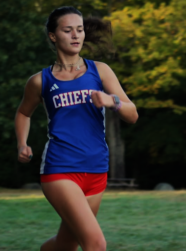 Junior Flora Frangu runs at the 65th Cross Country Invitational, fall 2024 (Courtesy of Arabella Rosa.)