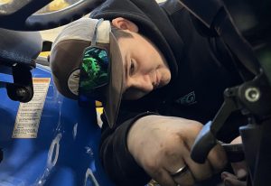 Nonnewaug senior Levi Johnson works on the New Holland tractor after school.