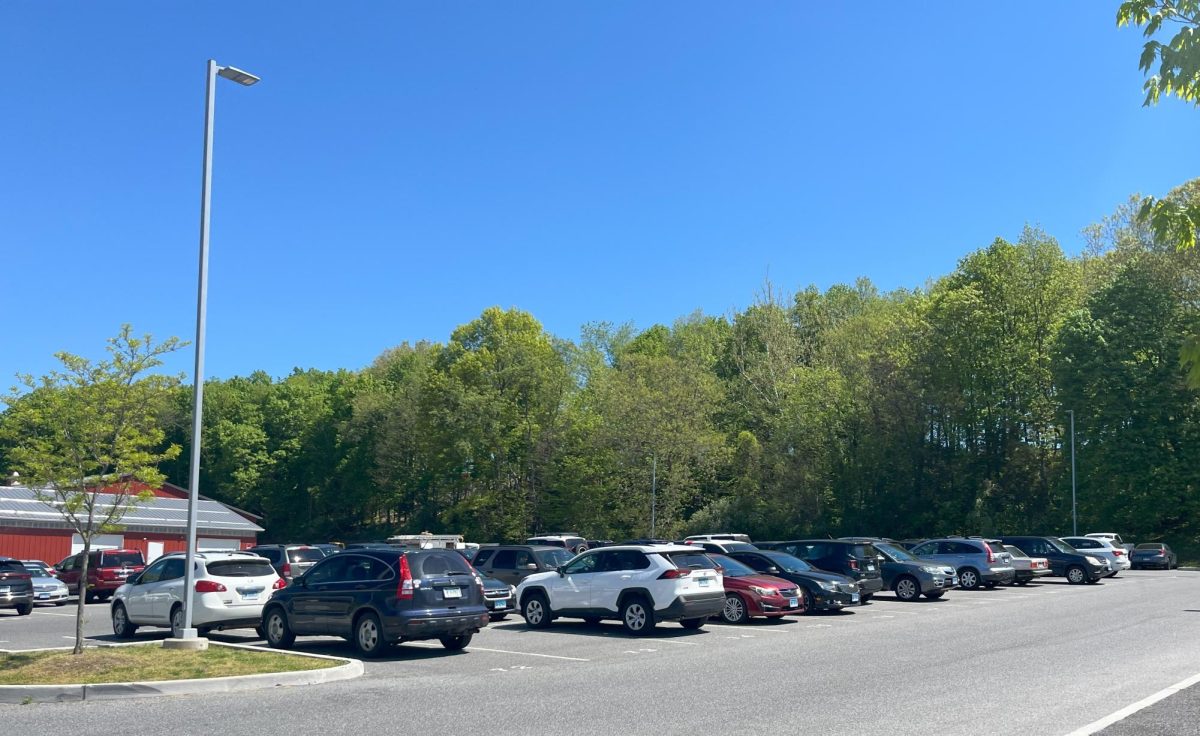 Nonnewaug's student parking lot shows no painted parking spots among students' parked cars.