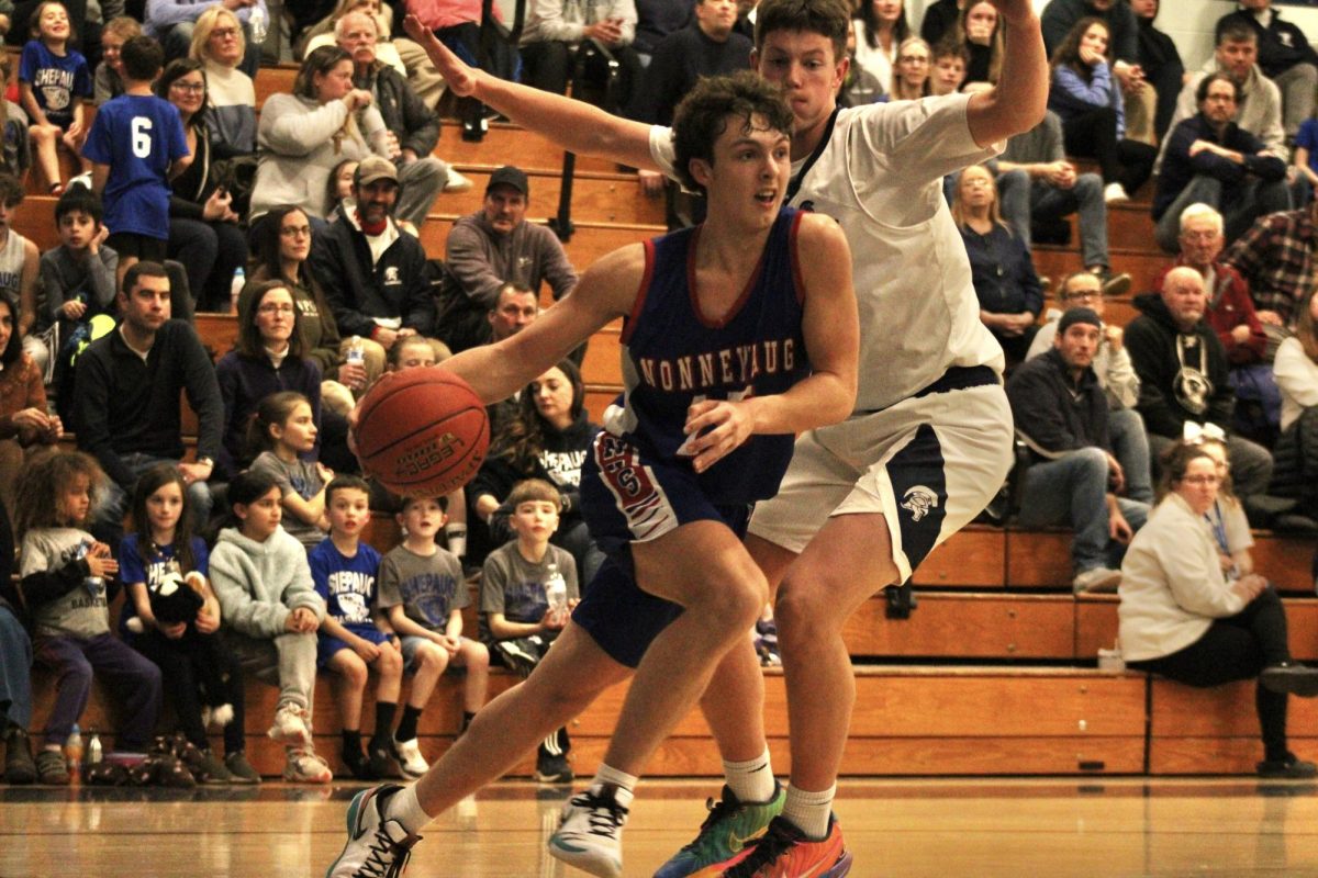 Senior Thomas Lengyel drives to the basket during Nonnewaug boys basketball game against Shepaug on Jan 3.  