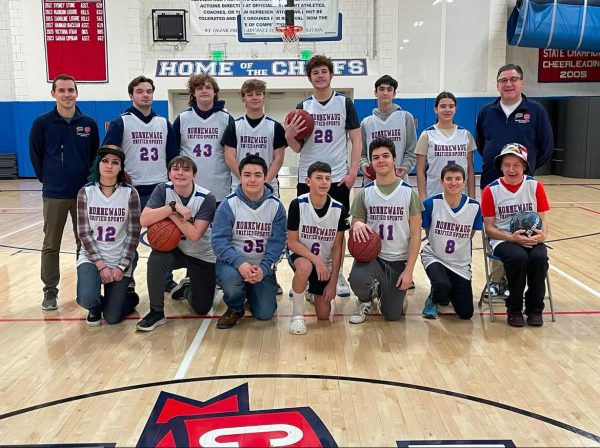 The Unified basketball team poses with coaches Conor Gereg and John Dominello. (Courtesy of Nonnewaug High School/Instagram)