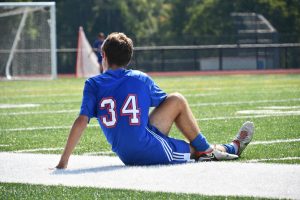 Nesim Iljazi warms up for a boys soccer game this past fall. Athletes need to be warming up like Iljazi.