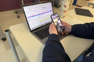 Elsie Crocco uses her phone during class. Teachers often grow frustrated by students who are distracted during class.