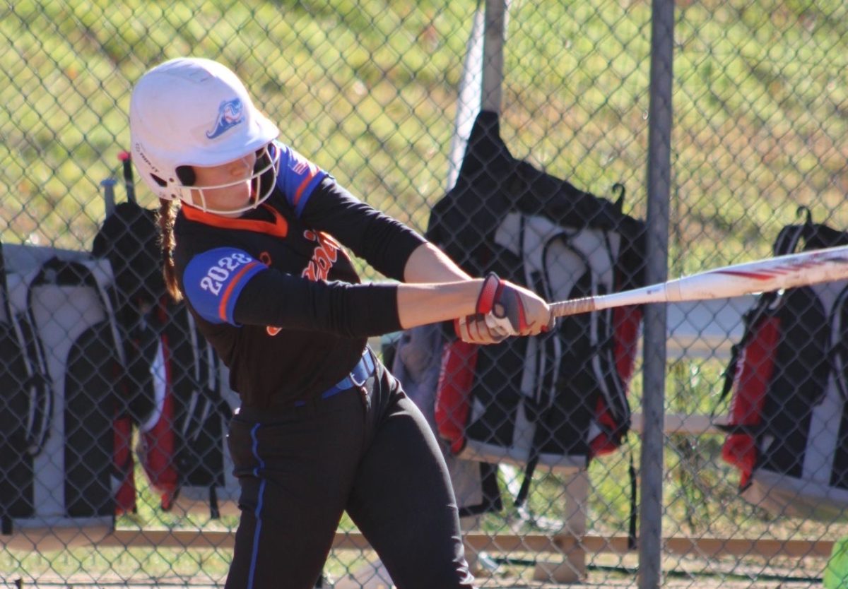 Ashlynn Blum swings during her Rapids travel game prior to her meniscus surgery. (Courtesy of Ashlynn Blum)