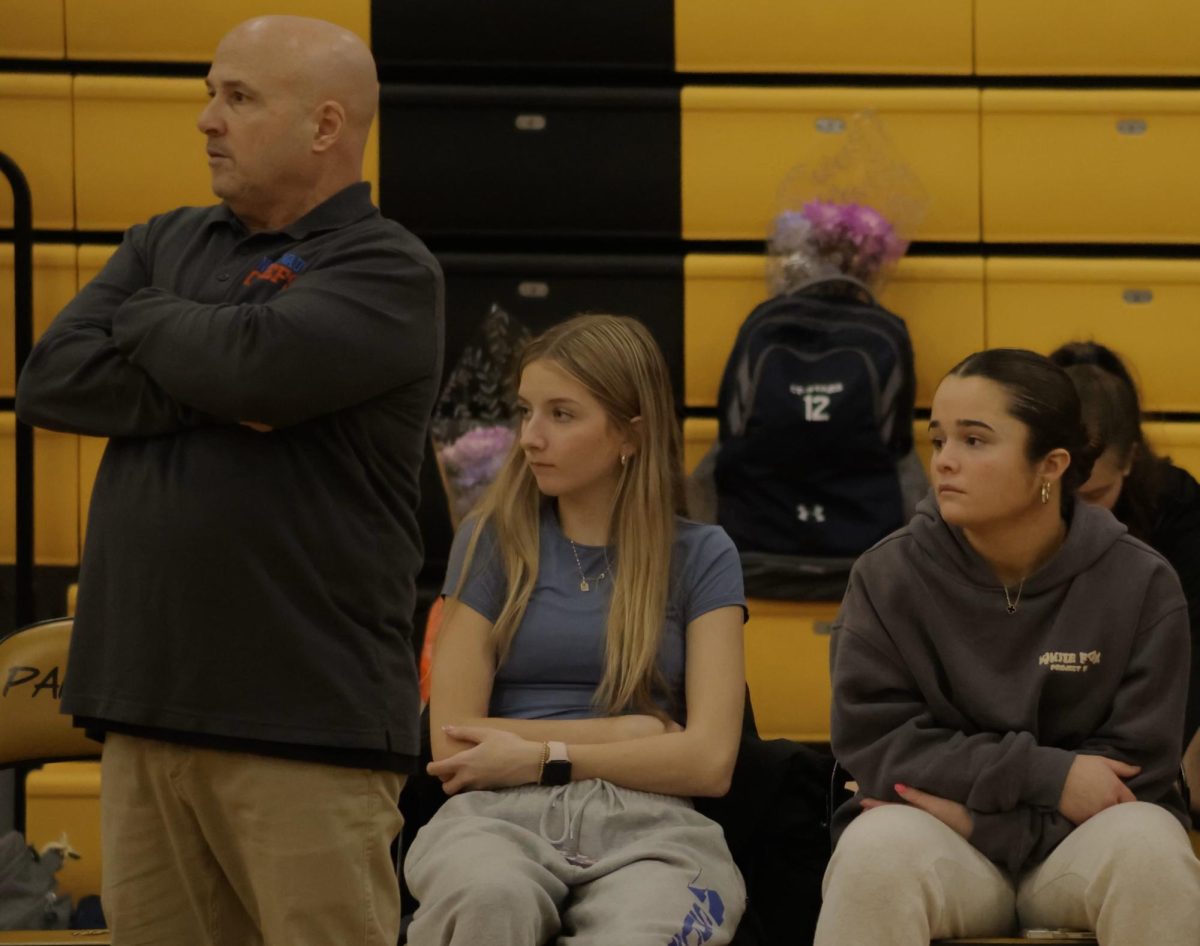 Olivia Gwiazdoski (right), an NHS junior point guard, has spent the 2024-2025 season recovering from a second knee injury that required surgery in November. Gwiazdoski's sophomore season was cut short following an injury to the same knee. Teammate McKenna Hardisty (middle) has also missed time due to head and knee injuries.  Photo Credit: Contributed 