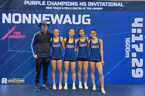 From left, Nonnewaug girls indoor track coach Arleigh Duff, Gianna Perugini, Ellie McDonald, Sophia Garguilo, and Maddie Garguilo pose for a picture after running the sprint medley at the Armory in New York. (Courtesy of Gianna Perugini)