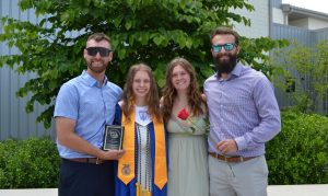 Kyleigh Page and her three other siblings at her oldest sister’s graduation. The last of the siblings to graduate and leave before Kyleigh does. Photo Credit: Courtesy of Kyleigh Page 